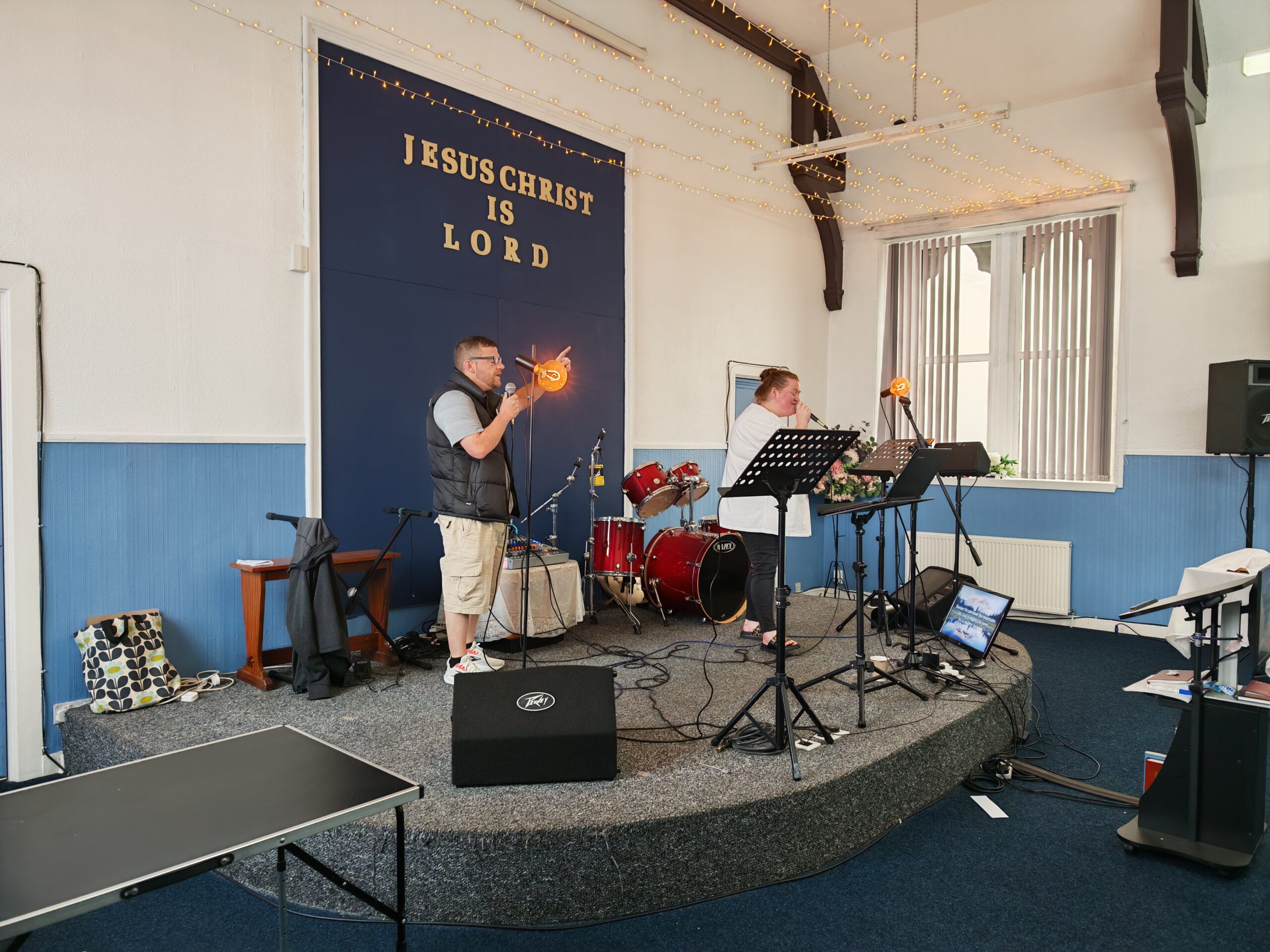 Worship leaders singing at Prospecthill Christian Fellowship